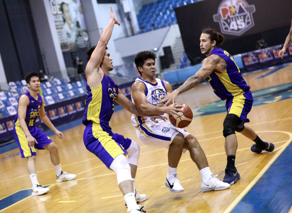 NLEX’s Kiefer Ravena protects the ball from two TNT defenders. (Photo from PBA)