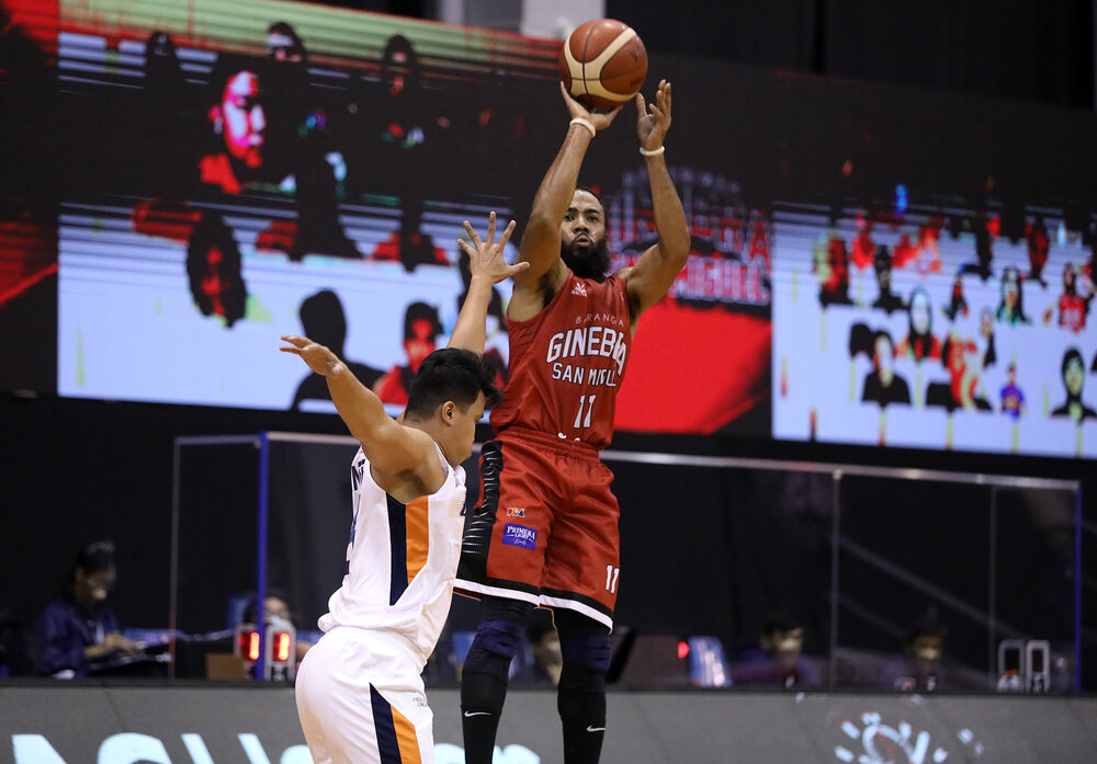 Ginebra’s Stanley Pringle attempts a jumper over Baser Amer of Meralco. (Photo from PBA)