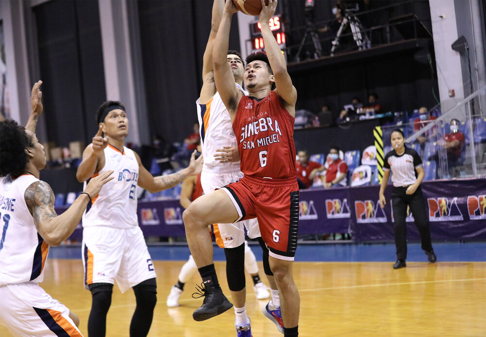 Ginebra’s Scottie Thompson drives past Aaron Black of Meralco. (Photo from PBA Media Group)