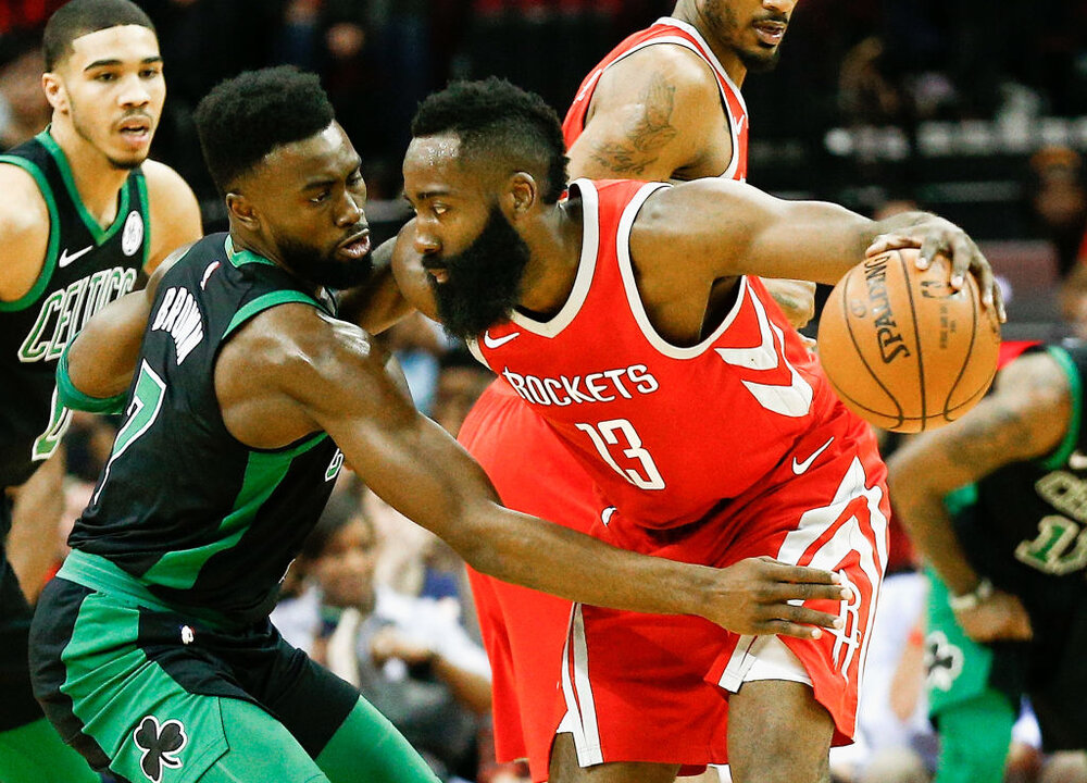 Rockets’ James Harden making a move against Jaylen Brown and Jayson Tatum of the Celtics. (Photo by Bob Levey/Getty Images)