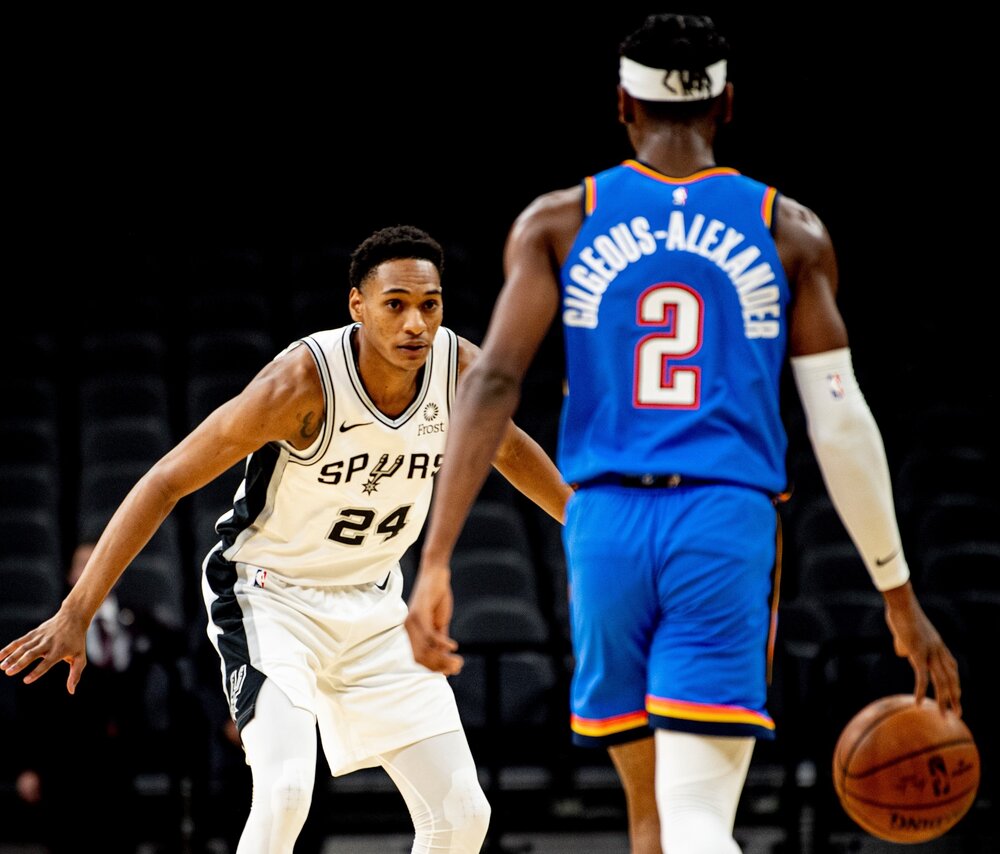 Spurs rookie Devin Vassell guarding Thunder’s Shai Gilgeous-Alexander. (Photo by Reginald Thomas II)