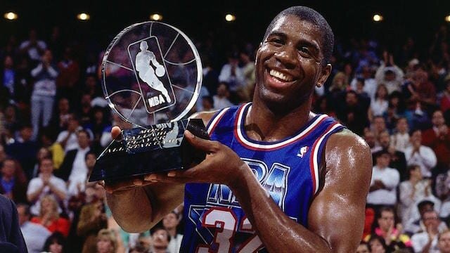 Magic Johnson holding the 1992 All-Star Game MVP trophy. (Photo by Nathaniel S. Butler/Getty Images)