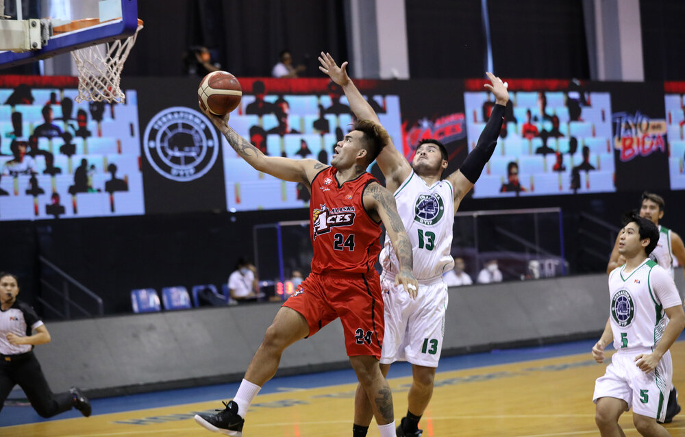 Alaska’s Vic Manuel drives past Eric Camson of TerraFirma. (Photo from PBA)