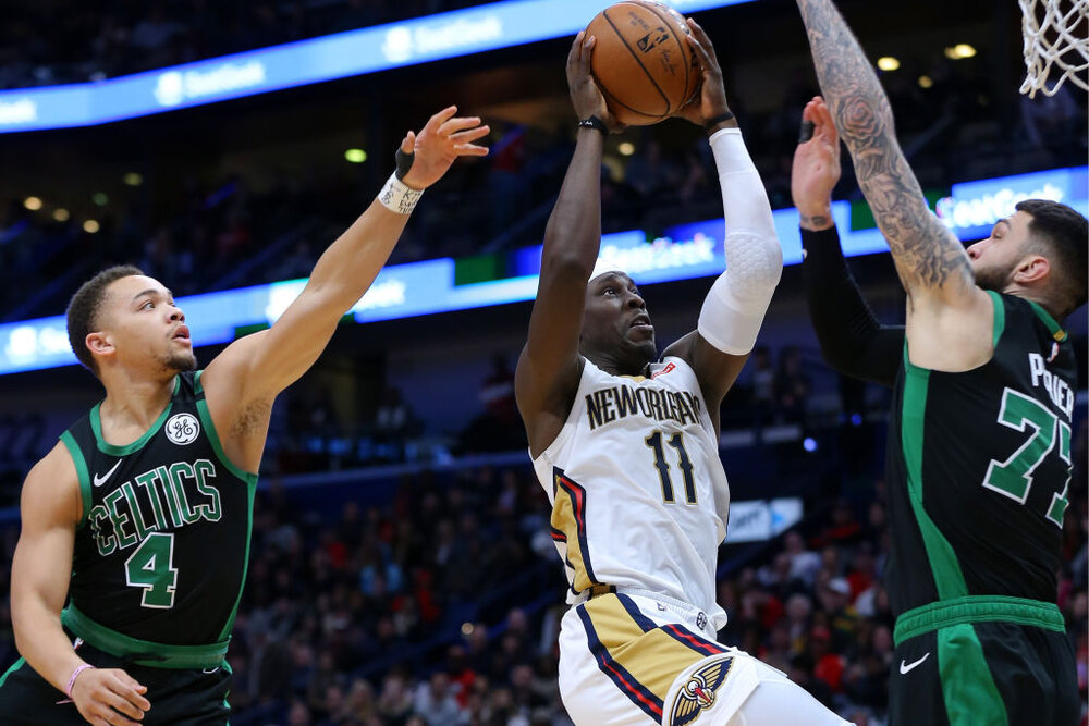 Jrue Holiday would make the Celtics a more complete team. (Photo by Jonathan Bachman/Getty Images)