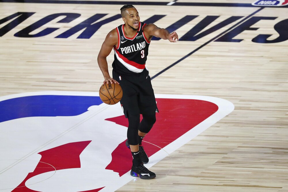 McCollum is also averaging a career-high 5.0 assists for the Blazers this year. (Photo by Kim Klement/AP)