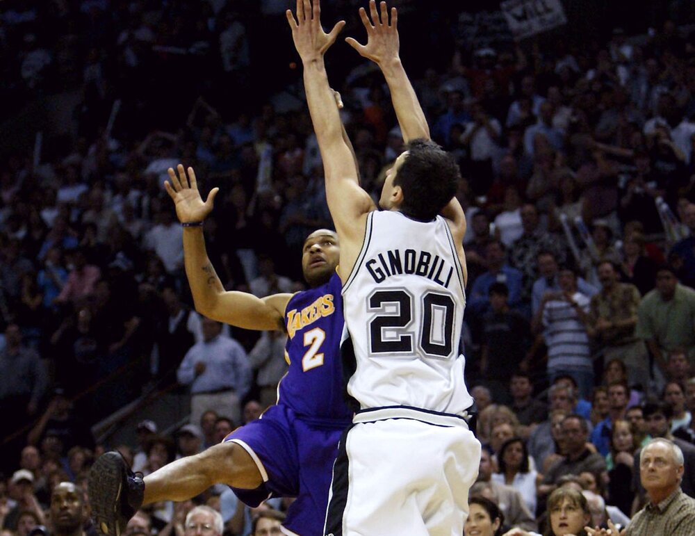 Derek Fisher puts up the famous “0.4” game-winning jumper over fellow lefty Manu Ginobili. (Photo by Stephen Dunn/Getty Images)