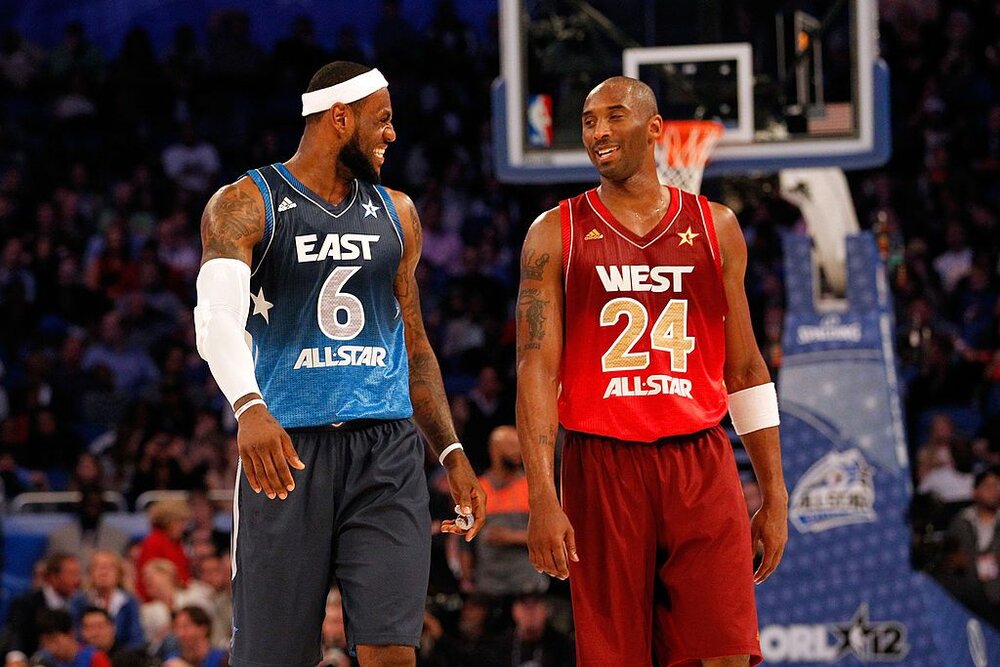 Kobe and LeBron James exchanging a few words during the 2012 All-Star Game. (Photo by Ronald Martinez/Getty Images)