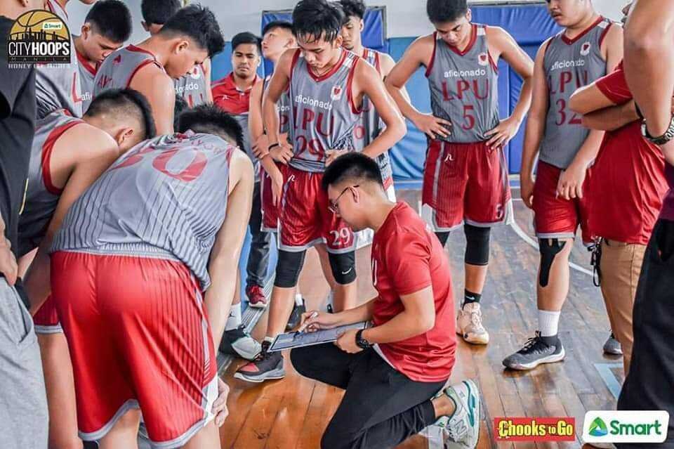 Coach Patrick drawing up a play for the LPU Cavite Junior Pirates