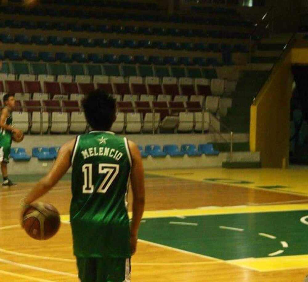 Coach Patrick donning the DLSU-D Patriots jersey during his collegiate years