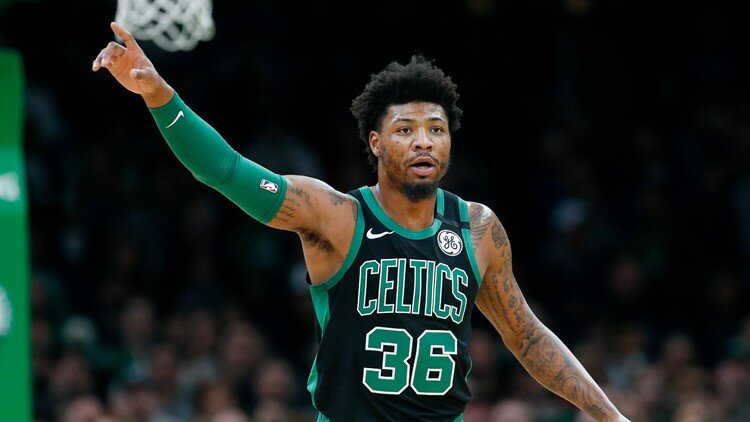 Boston’s defensive ace Marcus Smart also clicked on the offensive end in Game 1 against Toronto. (Photo by Michael Dwyer/AP)