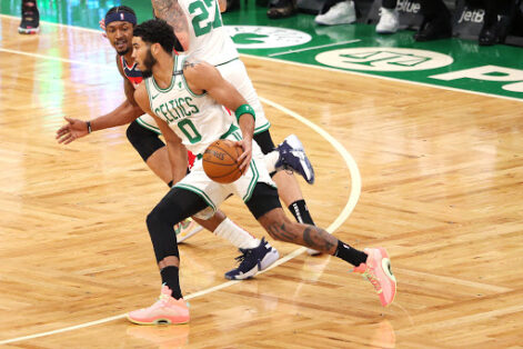Jayson Tatum drives past Bradley Beal. (Photo by Maddie Meyer/Getty Images)